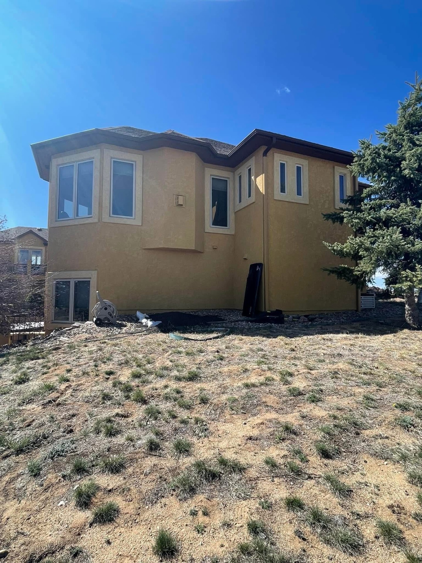 Rear two-story elevation — before